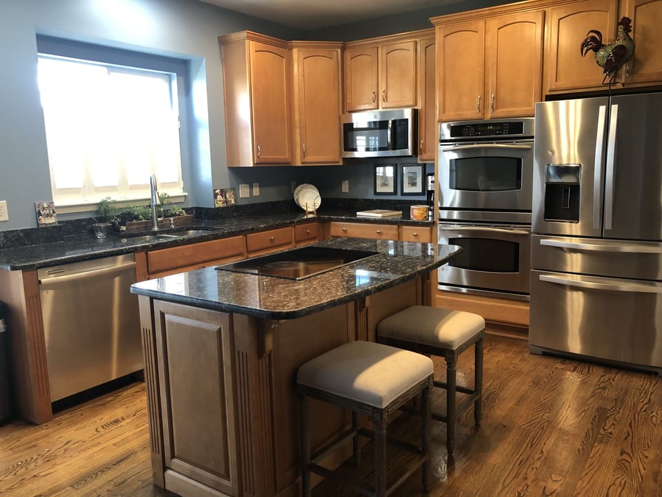 Kitchen with Granite Counter tops and Double Ovens