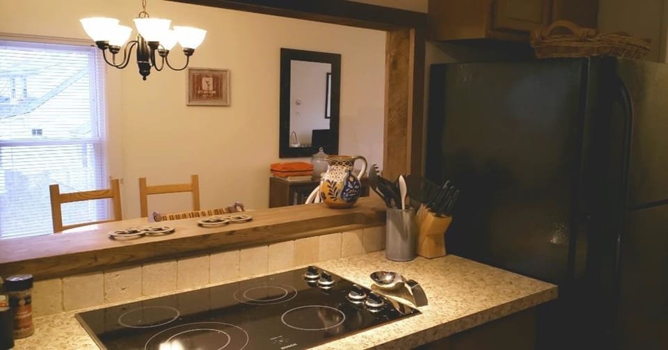 Pass thru' kitchen island makes it easy to cook and serve!