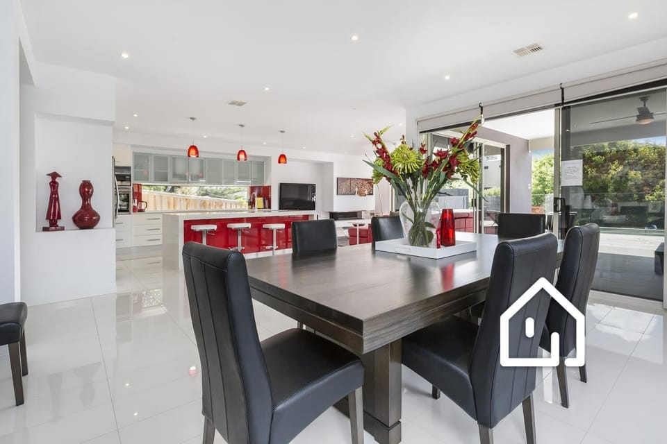 The dining setting includes 8 comfortable chairs