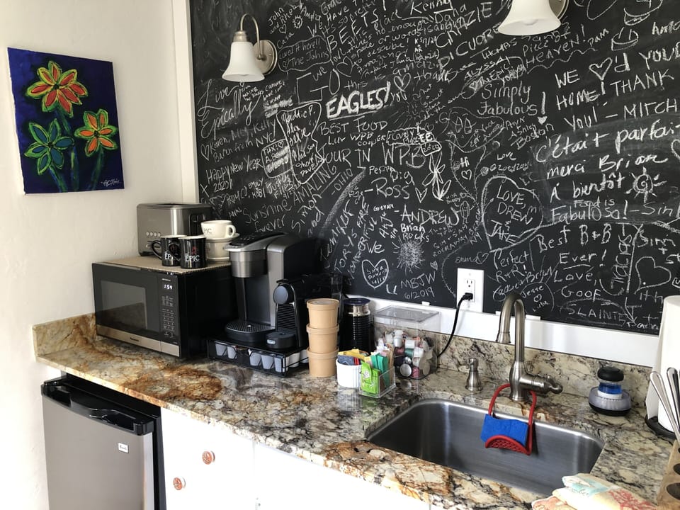 Kitchenette features toaster, microwave, Keurig®, Nespresso@, Harney & Sons teas