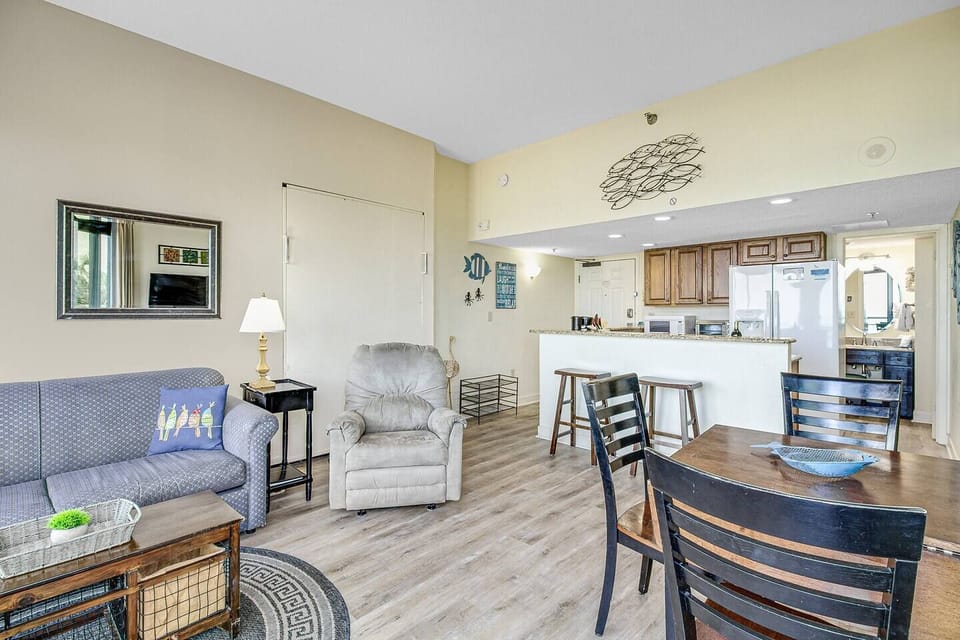 Immerse yourself in open-concept living, where the living area seamlessly transitions into the dining space, creating a spacious and welcoming environment for both relaxation and entertaining.