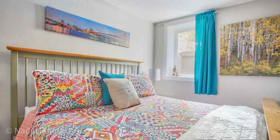 King sized bed in ground level bedroom