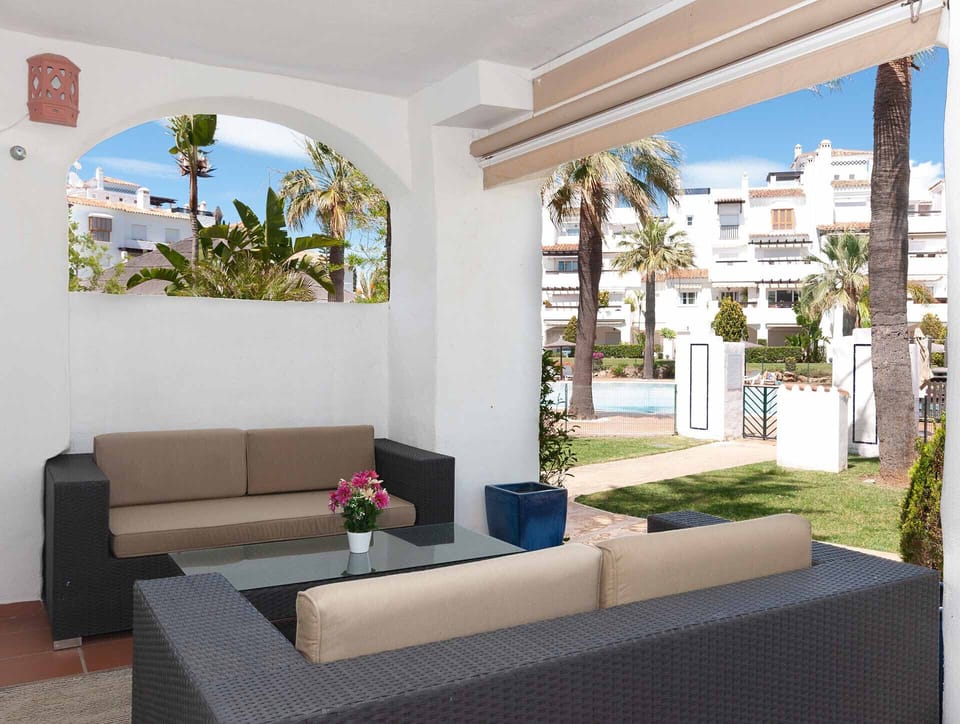 Furnished semi-private terrace with garden and pool views