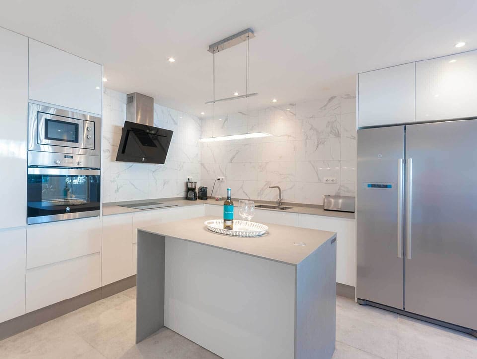 Sleek kitchen in beachfront apartment