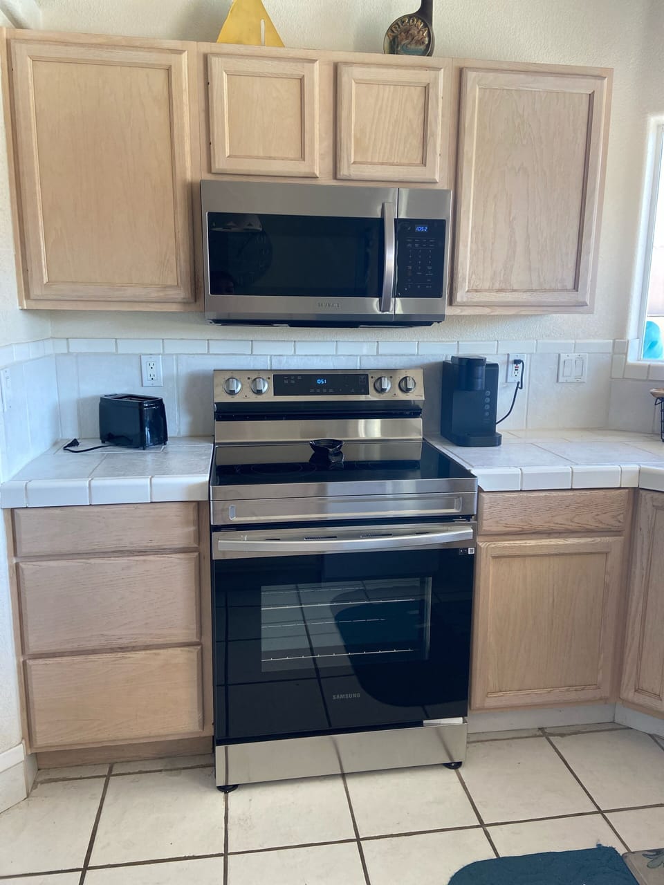 Newly updated electric stove and microwave.