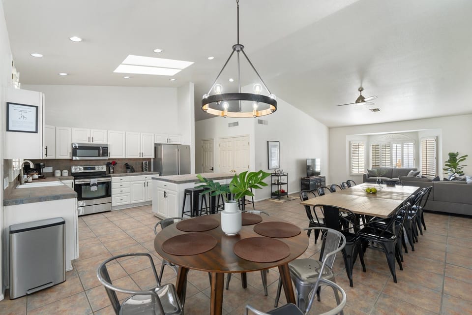 Dining area sits up to 20 people between two tables and a large island.