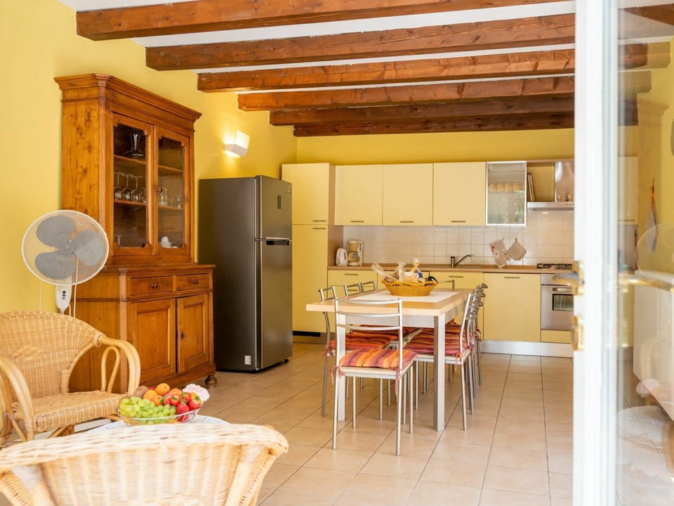 Table, Furniture, Cabinetry, Property, Countertop, Wood, Kitchen, Interior Design, Flooring, Yellow