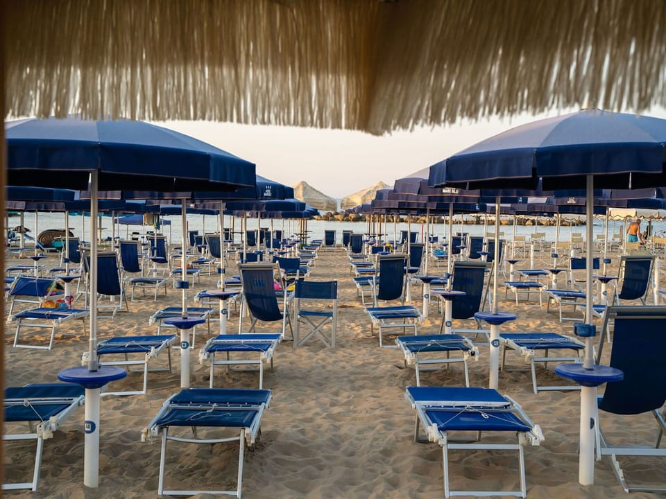 Furniture, Azure, Shade, Chair, Outdoor Furniture, Body Of Water, Umbrella, Leisure, Morning, Sky