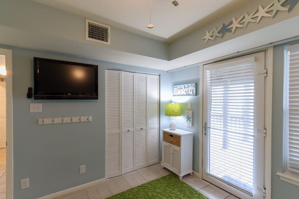Pack n' play, highchair, and monitor stored in Bunk Room closet