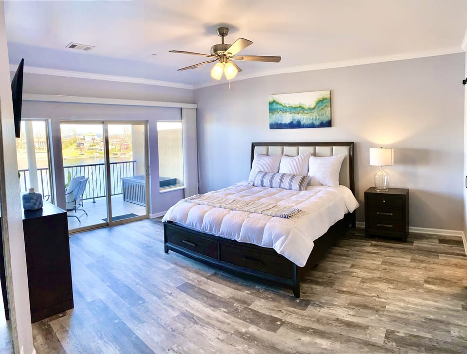 The spacious master bedroom has private access to the balcony