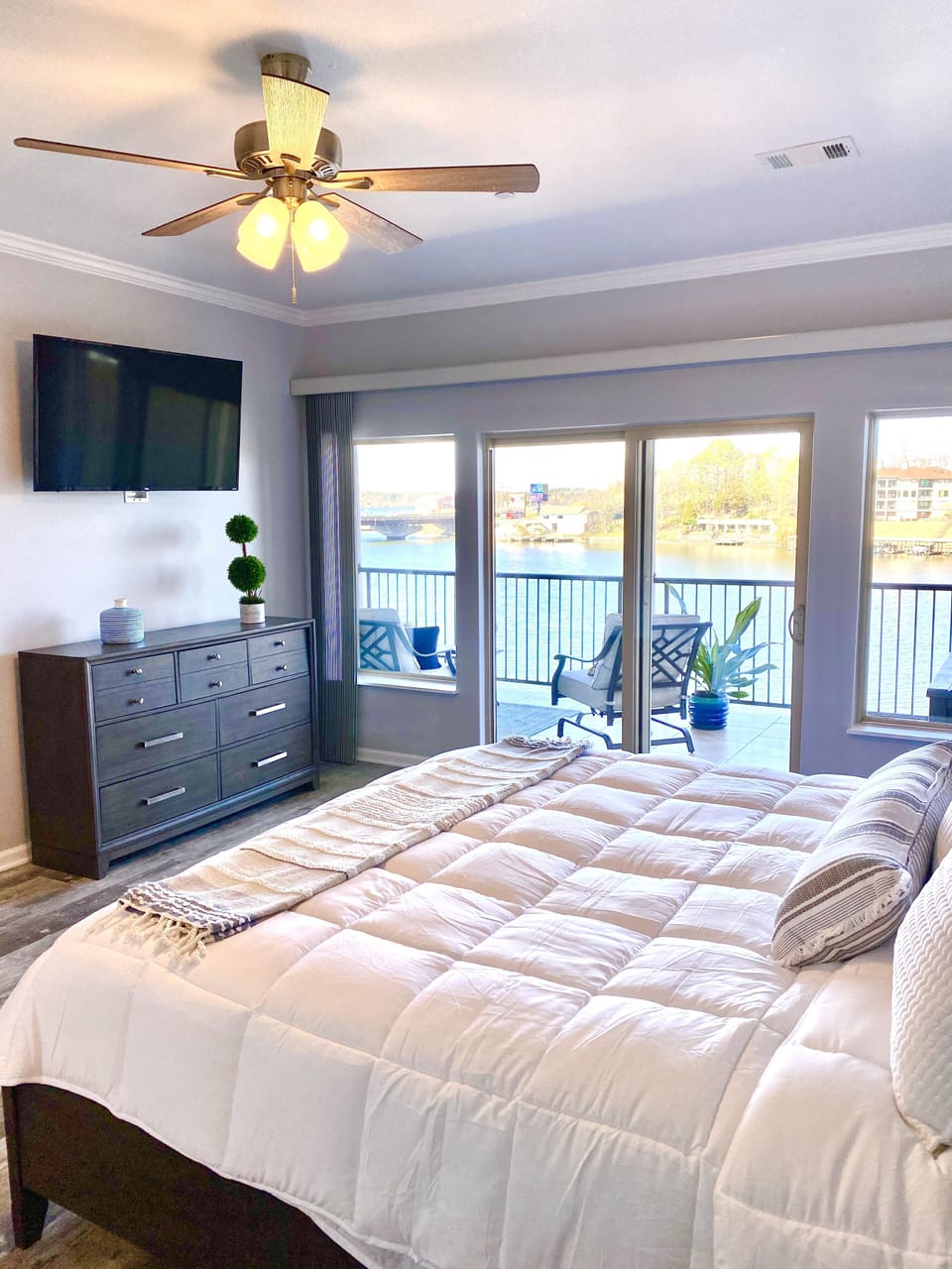 Enjoy lakefront views from the comfort of your king bed