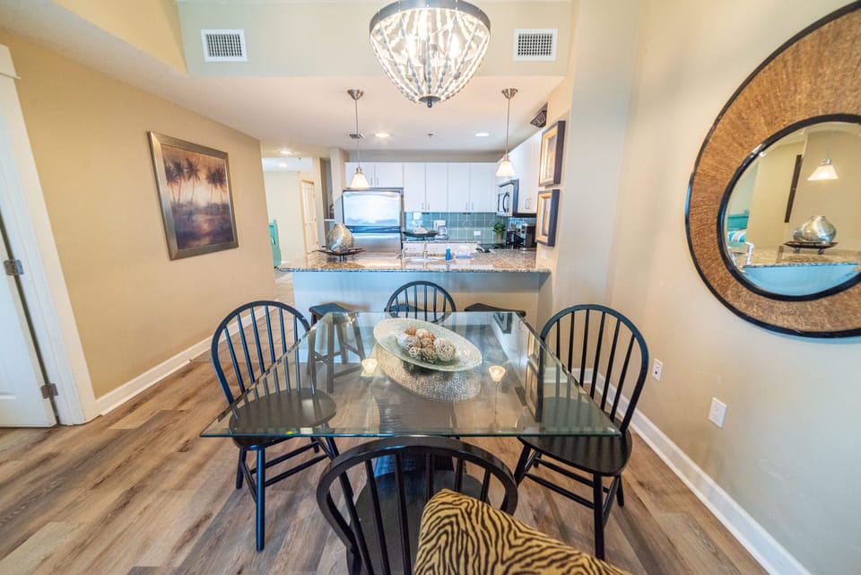 The dining room table comfortably seats 4 at the dining room table