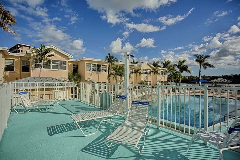 Stretch out on breezy loungers overlooking the shimmering water.