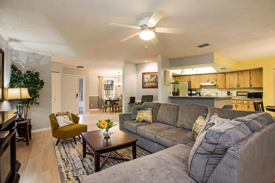 The living room is spacious and opens to the kitchen for great conversations