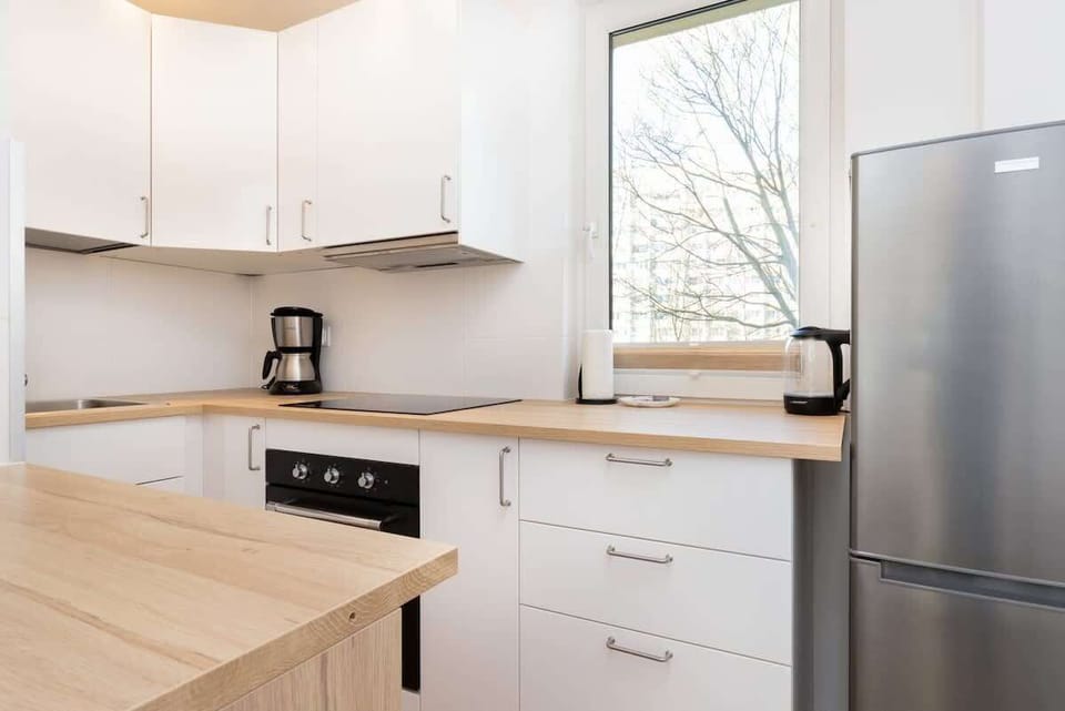 The kitchen is fully equipped with high-quality appliances for all your culinary needs.