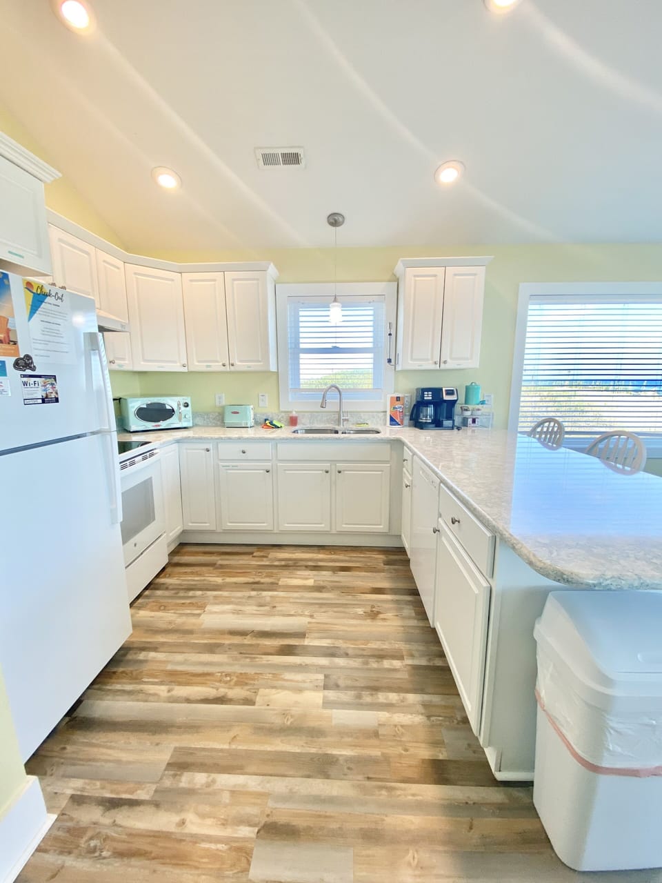 Clean and updated kitchen with new appliances, flooring and quartz countertops.