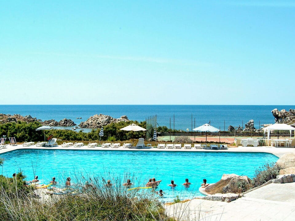 Water, Sky, Plant, Daytime, Blue, Swimming Pool, Building, Tree, Beach, Coastal And Oceanic Landforms