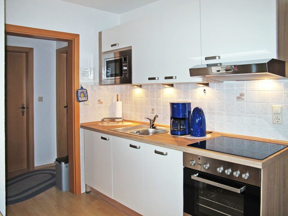 Countertop, Cabinetry, Room, Kitchen, Furniture, Property, Kitchen Stove, Building, Interior Design, Major Appliance