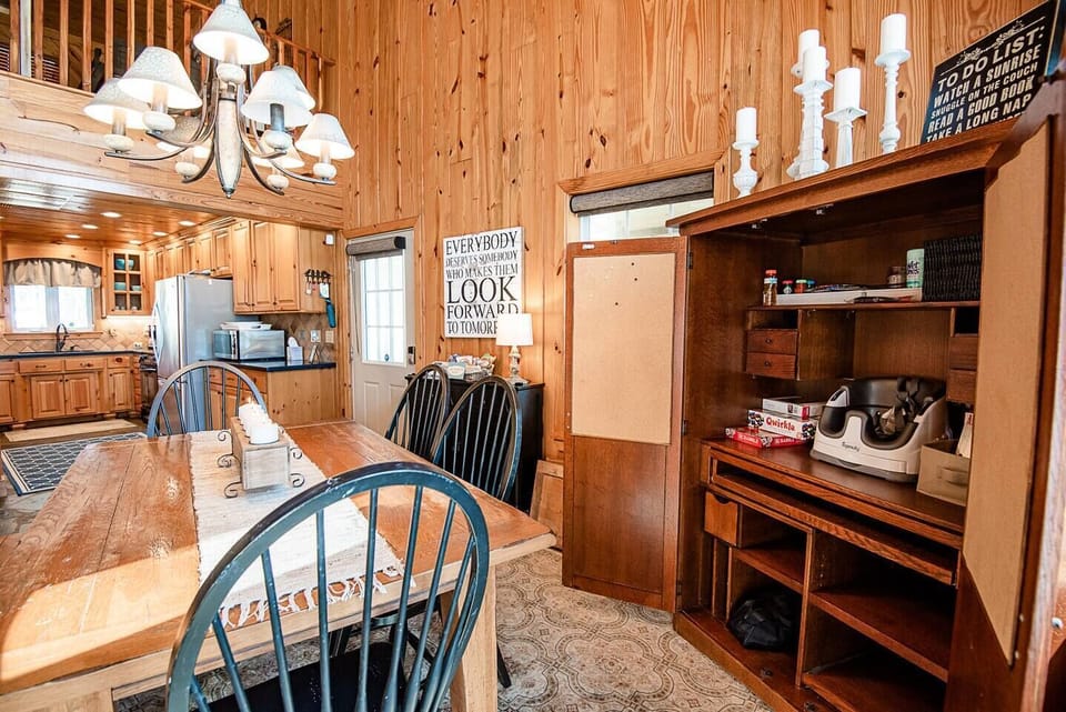 Dining cupboard has portable high chair and games for the family