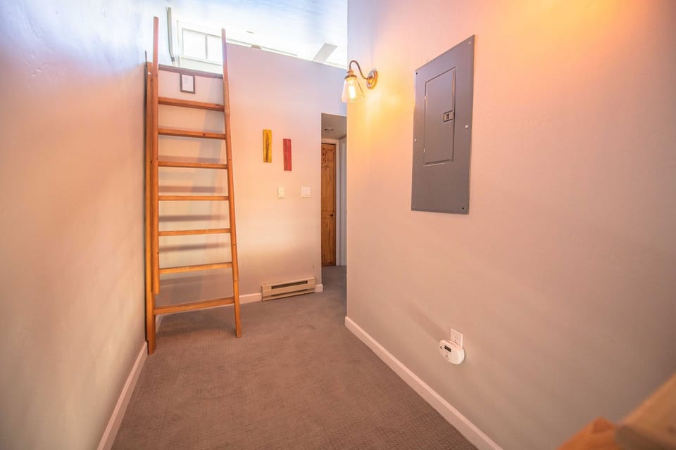 Ladder to loft and 2nd living room. 