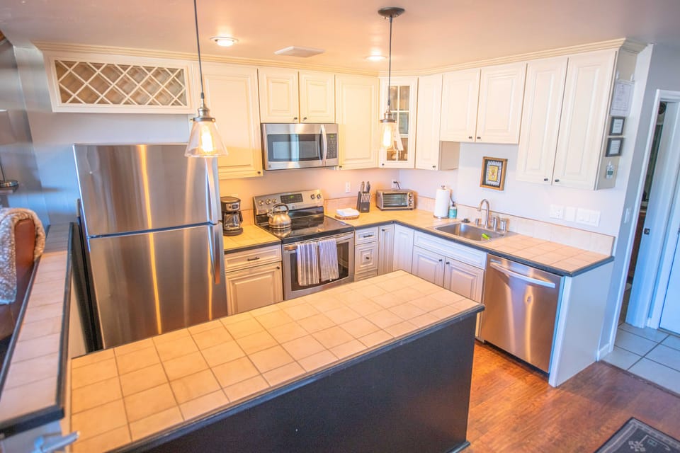 New stainless appliances, filtered water, and generously stocked kitchen.