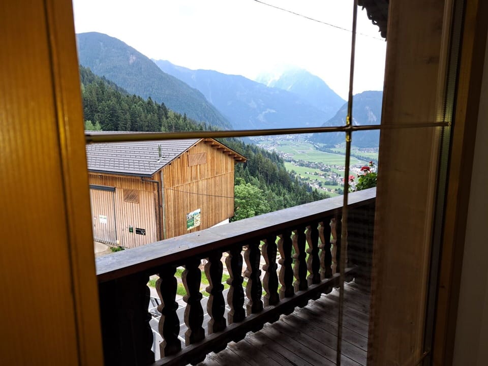 Sky, Property, Building, Mountain, Wood, Tree, Architecture, Fence, Plant