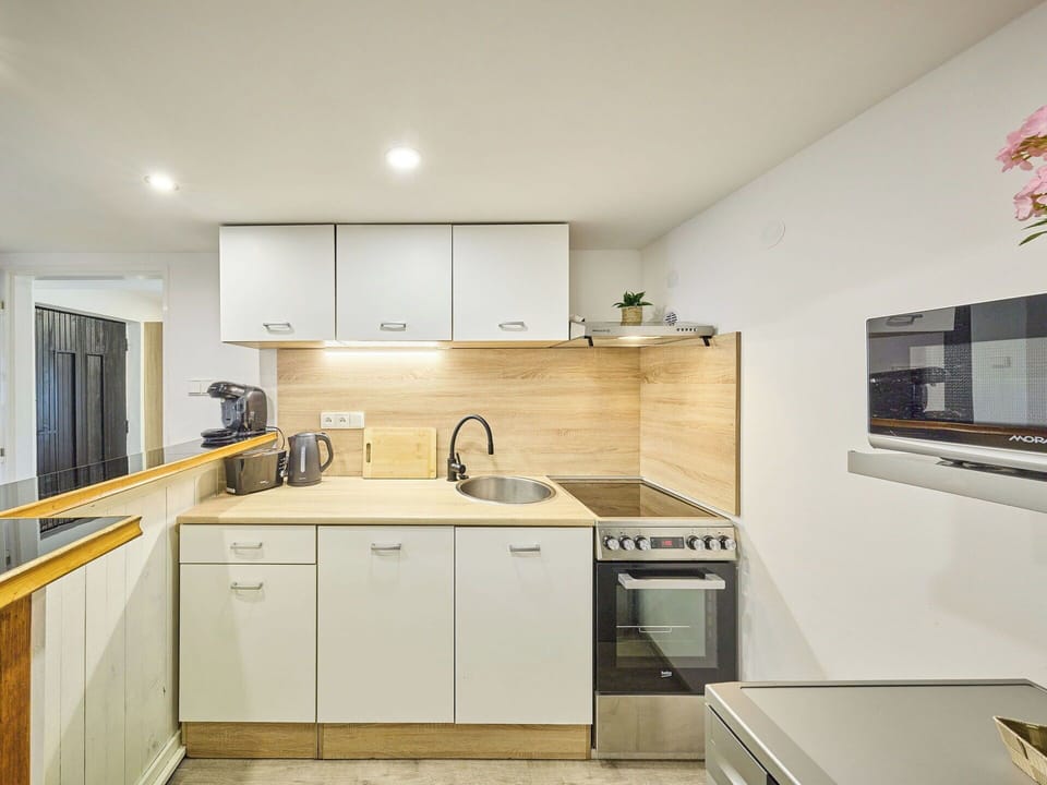 Kitchen, Countertop, Kitchen Appliance, Interior Design, Flooring, Major Appliance, Cabinetry, Furniture, Wood, Floor
