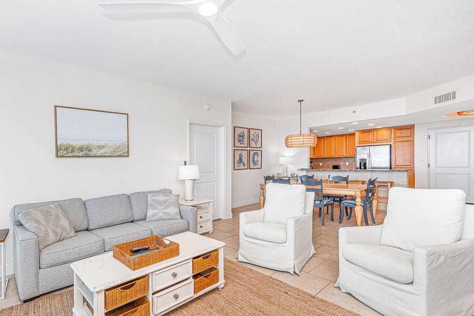Relax in your spacious open-concept retreat with comfortable seating, warm wood accents, and a fully equipped kitchen perfect for memorable meals together.