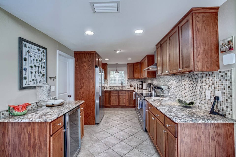 Large kitchen has been wonderfully updated with stainless appliances.  Wine refrigerator too.