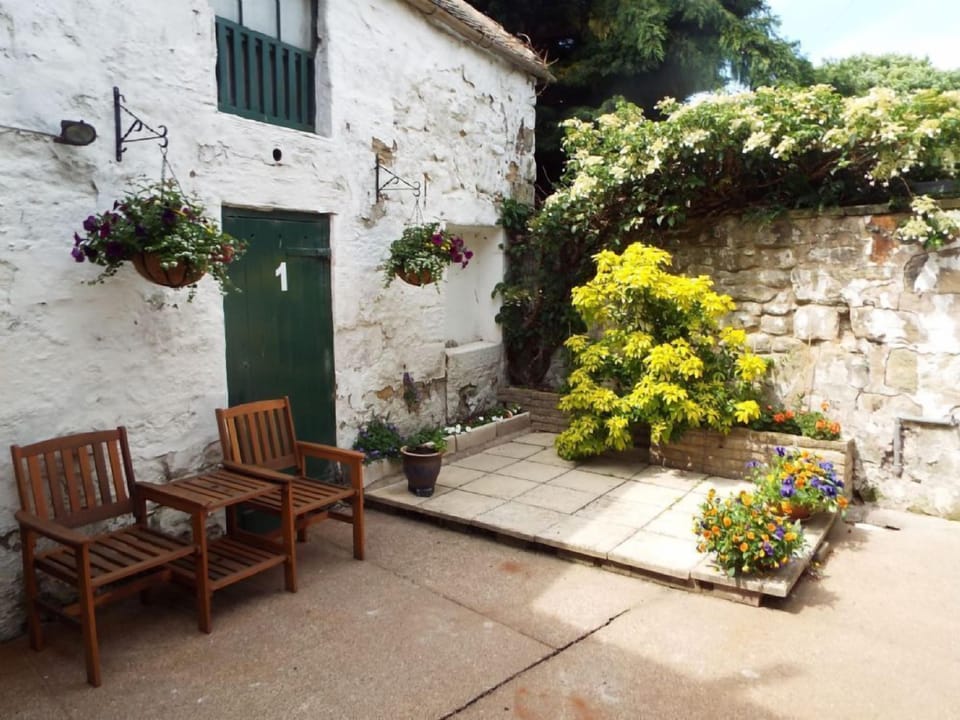 into the courtyard with secure cycle shed and bbq storage
