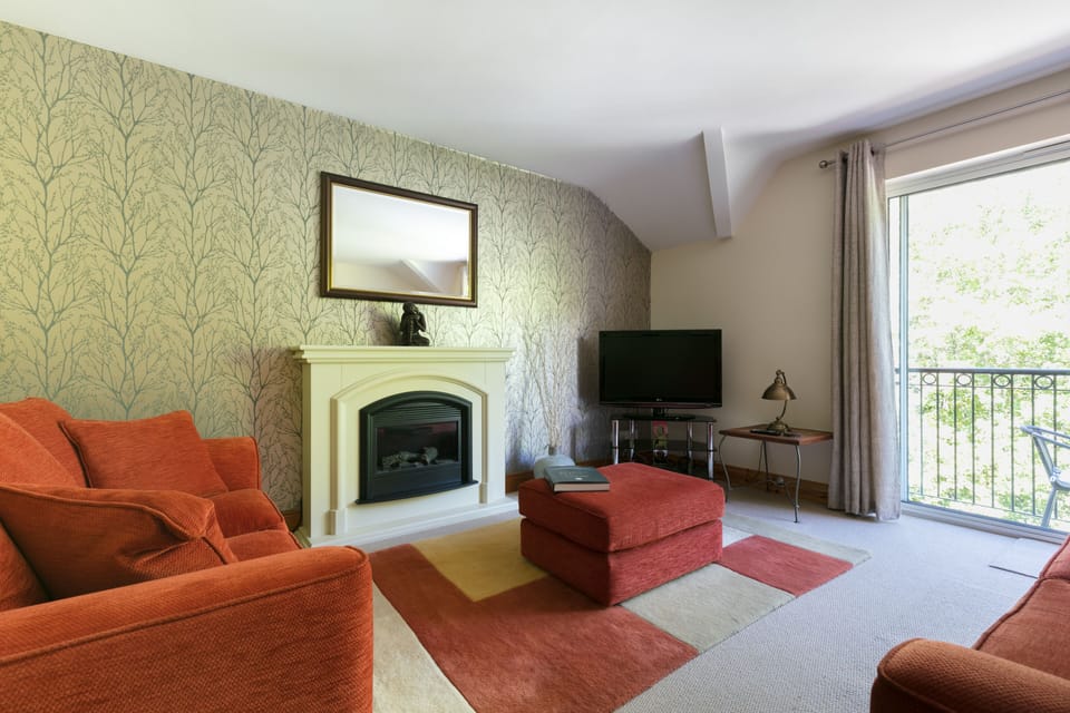 large living area,with beautiful fireplace,and balcony.