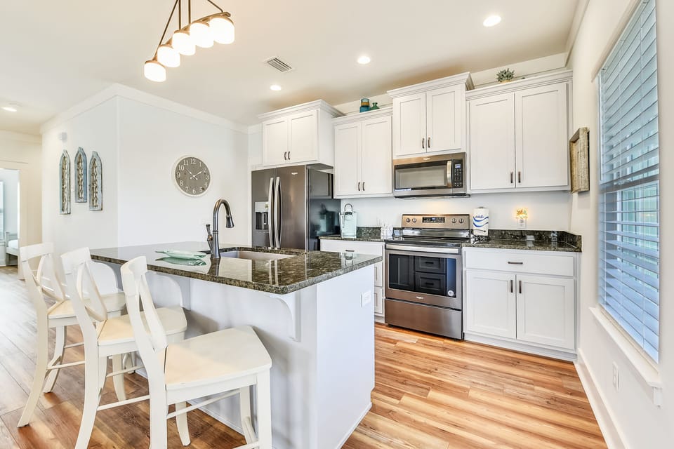 Bar Seating and Fully Stocked Kitchen