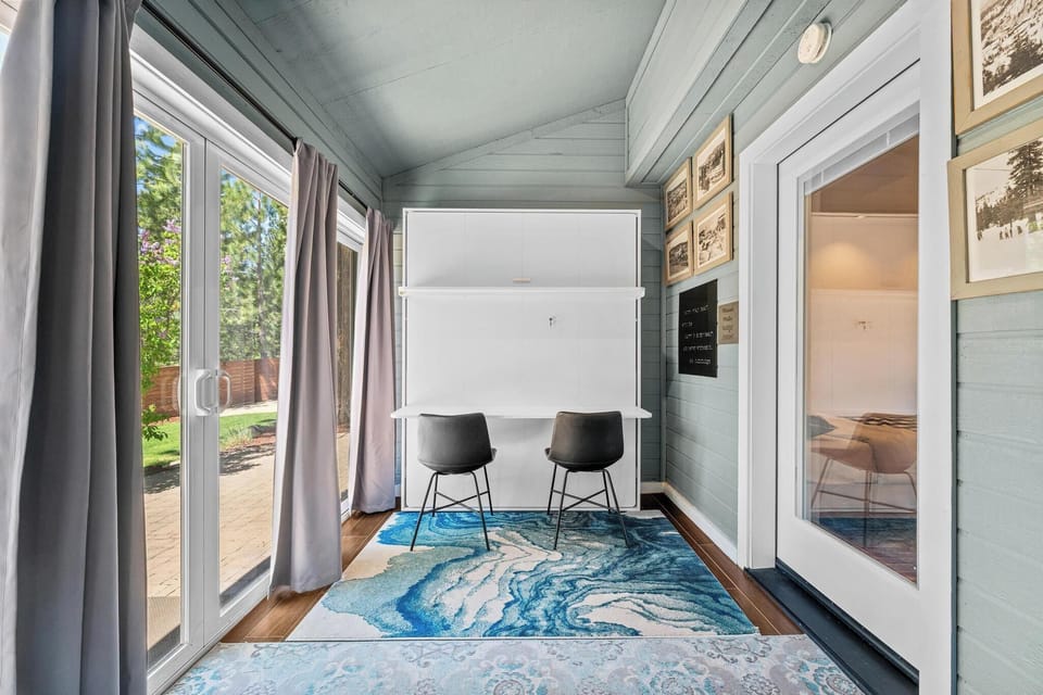 Murphy Bed Sunroom 4th bedroom. Folds down and can double as your own private closed off office with desk and chairs.