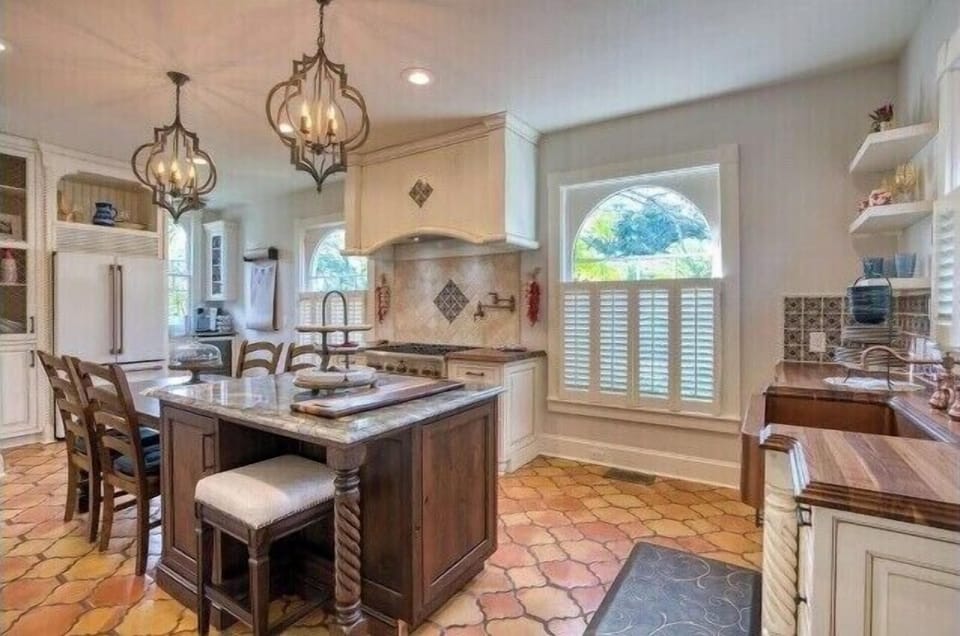 Bright backdrop for a bespoke Spanish style kitchen.