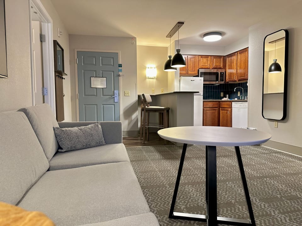 Bright living and dining area with comfortable seating.