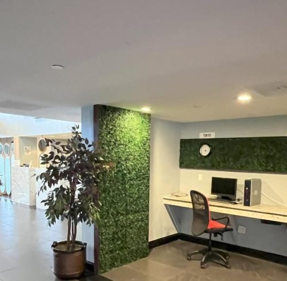 Step into a quiet corner workspace framed by calming greenery.