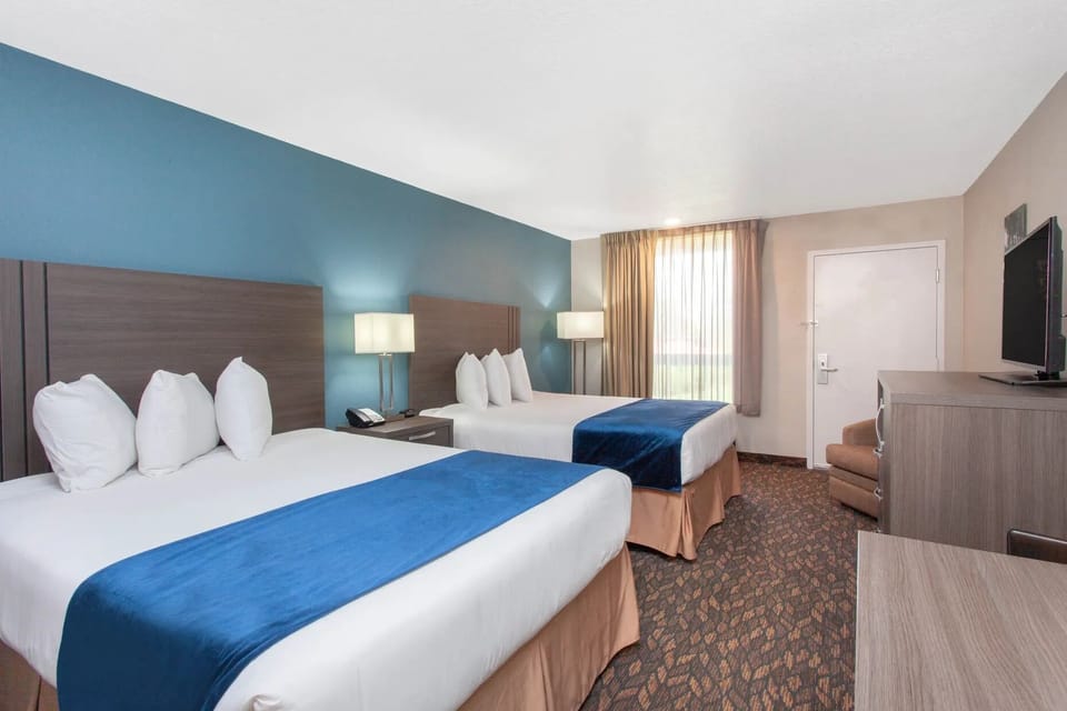 Unwind in crisp, cozy beds after a busy day.