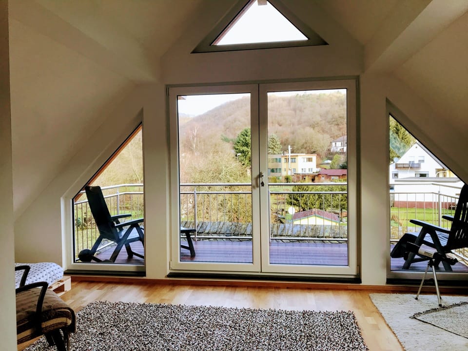 View of the sunroom from the bedroom with the queen bed