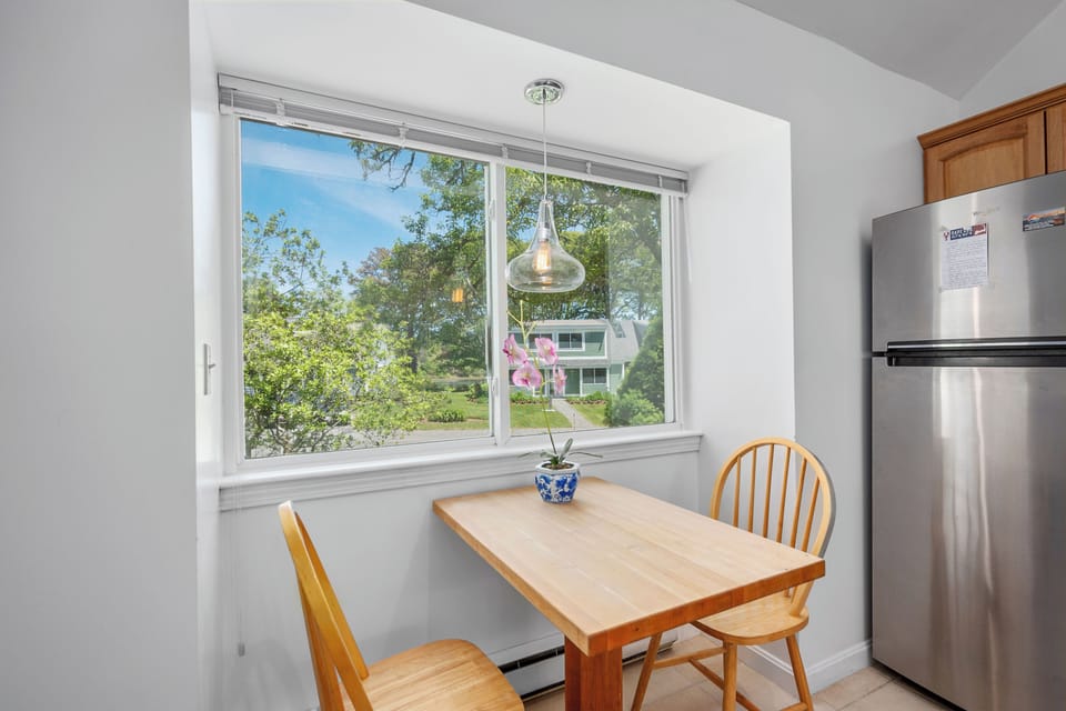 Kitchen bistro dining with views of the pond