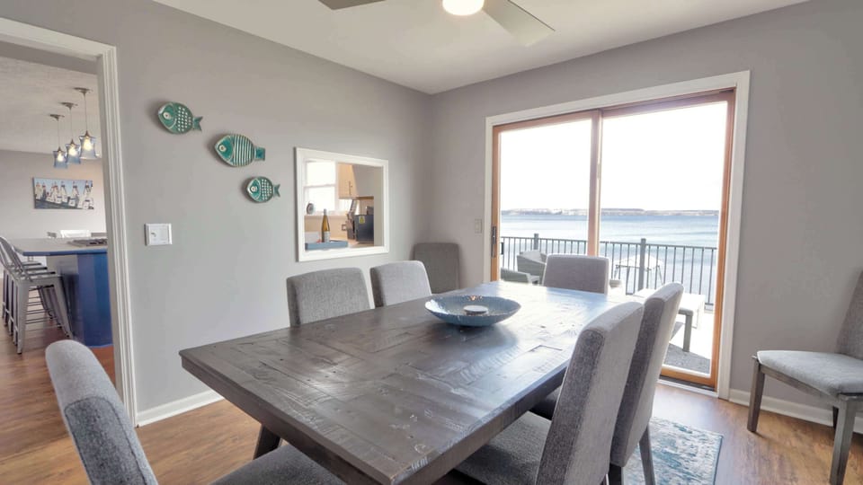 Dining Room- Dinner with a view — gather around the table and take in the lake just beyond the glass