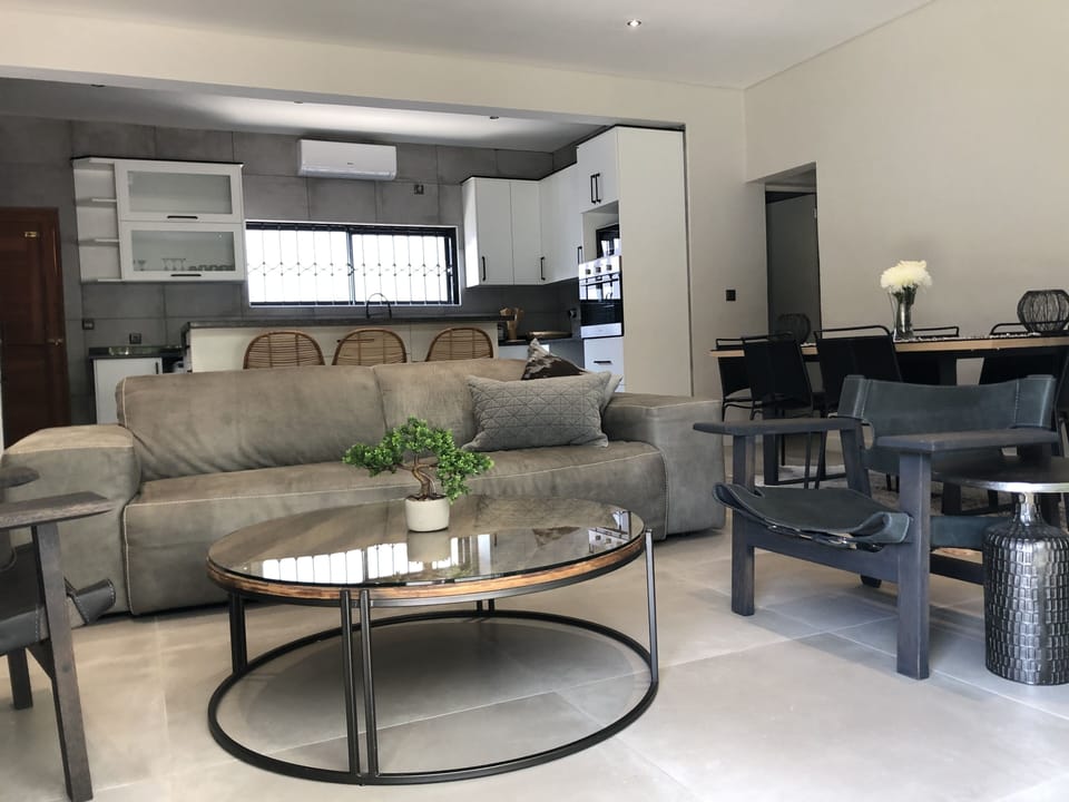 Living in luxury seating area with a view to the yard and a TV