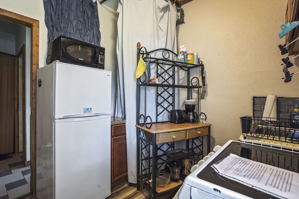 kitchen with refrigerator and bakers shelf