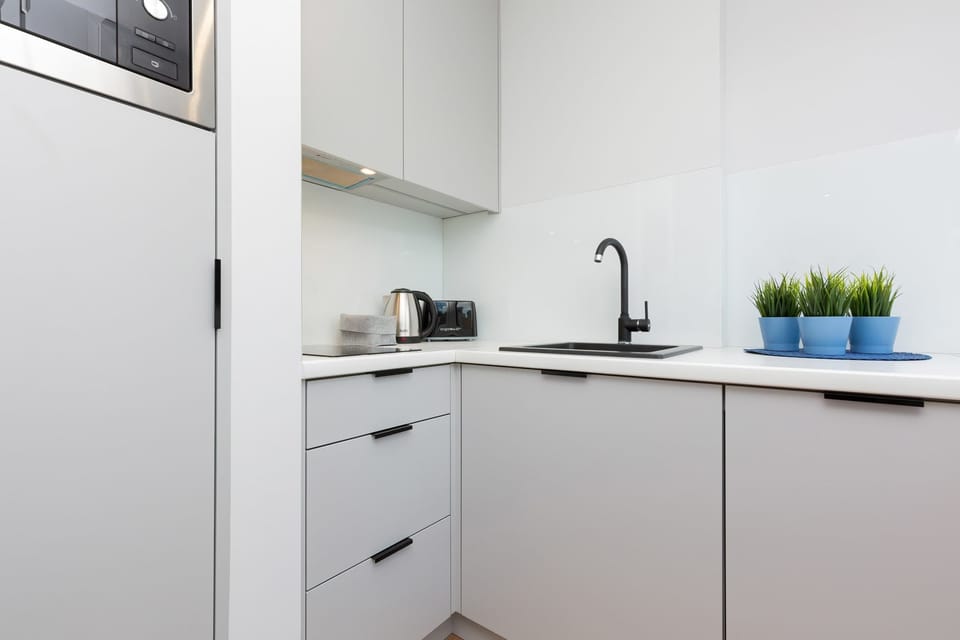 The fully equipped kitchenette includes everything you need for a home-cooked meal.