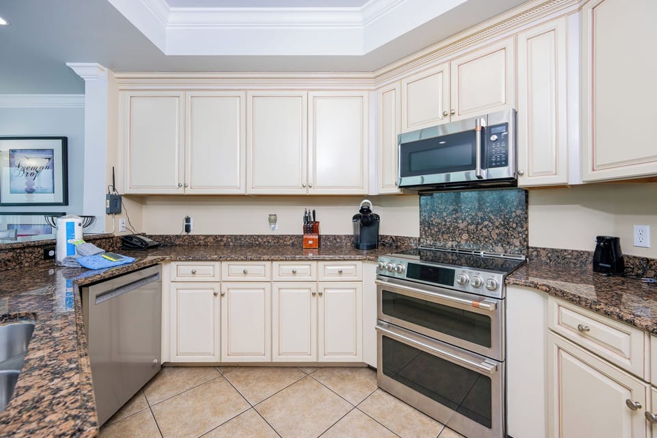 Upgrade your culinary experience in this stylish kitchen with modern stainless appliances and elegant design