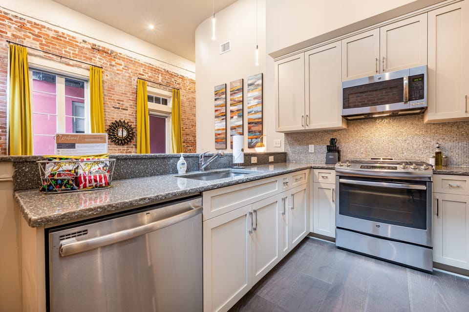 Cook and dine easily in the fully stocked kitchen, equipped with all stainless steel appliances, gas range, basic cookware, and a dining area for a comfortable meal at home. Entertain at the bar with seating for four.