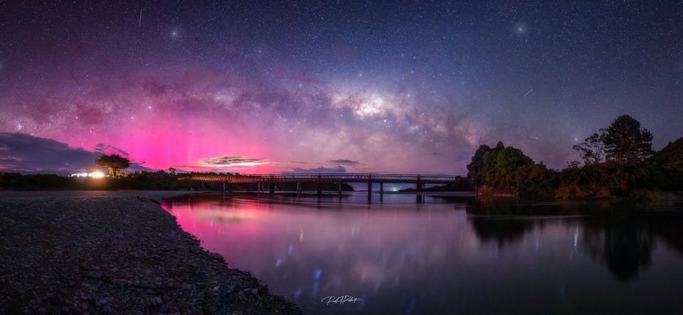 Aurora Australis and the Milky Way captured on the riverbed by the house.