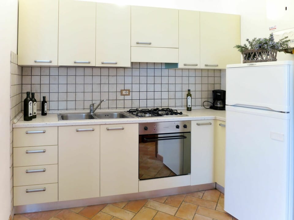 Kitchen, Cabinetry, Room, Furniture, Property, Countertop, Major Appliance, Kitchen Stove, Interior Design, Tile