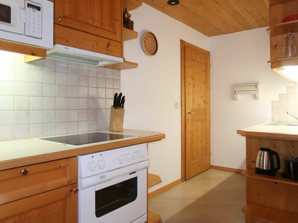 Cabinetry, Furniture, Building, Countertop, Drawer, Kitchen, Wood, Lighting, Interior Design, Kitchen Stove