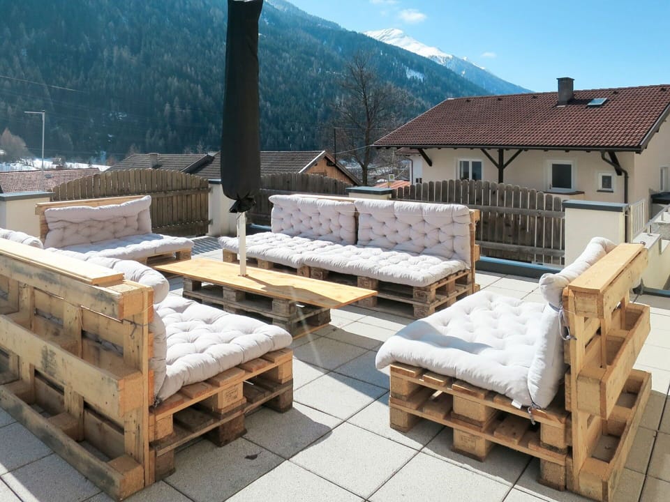 Sky, Table, Furniture, Outdoor Bench, Building, Wood, Window, Tree, Outdoor Furniture, Mountain