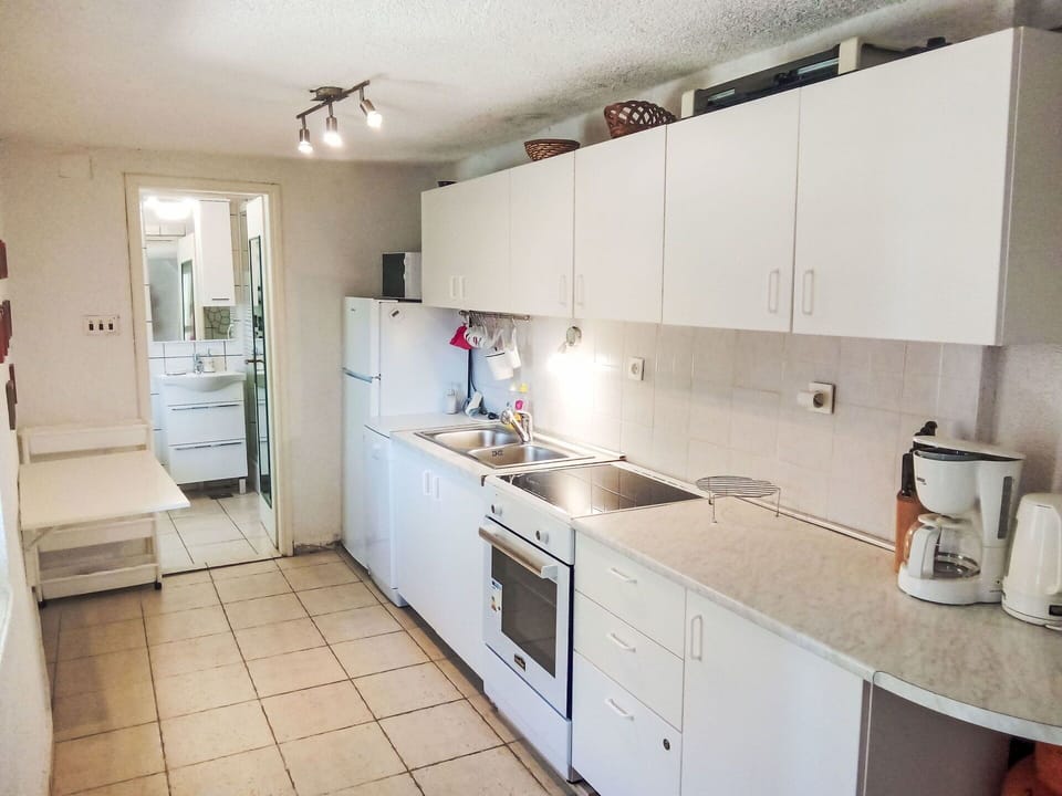 Kitchen, Countertop, Kitchen Appliance, Flooring, Cabinetry, Major Appliance, Floor, Wood, Interior Design, Kitchen Sink